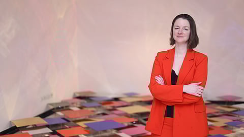 Liz with the installation in the background