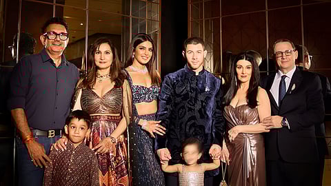 Priyanka Chopra and Nick Jonas (C) with family at the wedding celebrations 