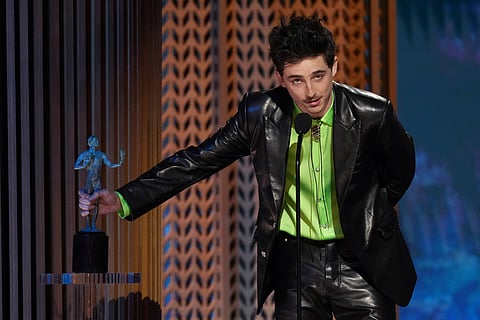 Timothee Chalamet accepts the award for outstanding performance by a male actor in a leading role for 'A Complete Unknown' during the 31st annual Screen Actors Guild Awards on Sunday, Feb. 23, 2025, at the Shrine Auditorium in Los Angeles