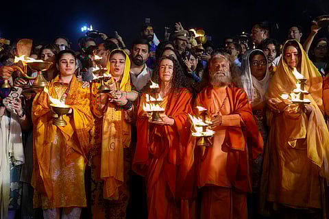 (R-L) Bollywood actor Katrina Kaif, spiritual leader Swami Chidanand Saraswati, Sadhvi Bhagawati Saraswati, Bollywood actor Raveena Tandon and her daughter Rasha Thadani rotate traditional oil lamps to perform an evening ritual 'Aarati' Sangam during the Maha Kumbh festival, which is one of the world's largest religious gatherings, celebrated every 12 years in Prayagraj, Uttar Pradesh on Monday, Feb. 24, 2025