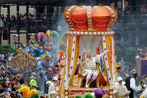 FILE - Rex, the King of Carnival, rides in the Krewe of Rex as he arrives at Canal St. on Mardi Gras day in New Orleans, March 8, 2011