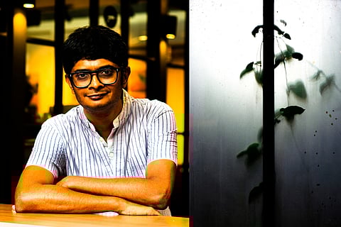 In frame: Vivek Matthew and one of the photo art on exhibition