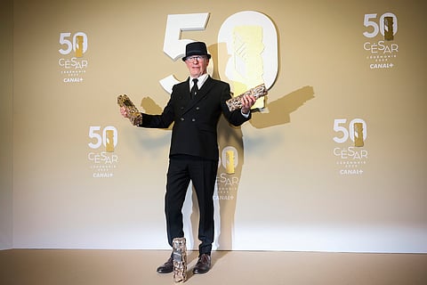 Jacques Audiard poses after receiving three awards for the movie 'Emilia Pérez' during the 50th Cesar Awards ceremony in Paris, early Saturday, March 1, 2025