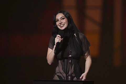 2 of 15 | EDS NOTE: NUDITY - Charli xcx accepts the artist of the year award during the Brit Awards 2025 in London