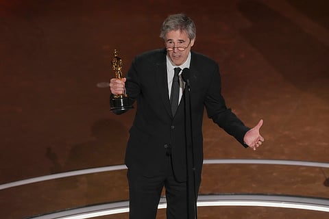 Walter Salles accepts the award for the film, "I'm Still Here"
