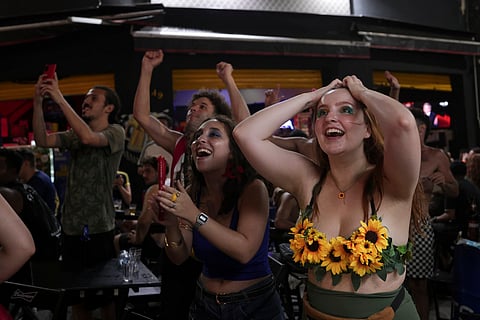 People celebrate upon learning that Brazilian film 'I'm Still Here' won the Oscar for best International Feature Film in Sao Paulo on Sunday, March 2, 2025