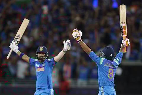 India's Ravindra Jadeja, right, and batting partner KL Rahul celebrate their win in the ICC Champions Trophy final