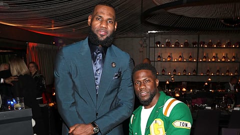 LeBron James can't stop laughing at Kevin Hart's football story