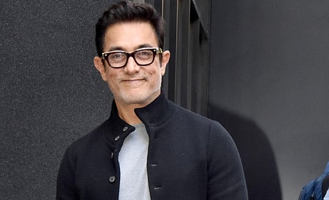 Aamir Khan gives out mithai on Eid, poses with his sons and clicks selfies with fans