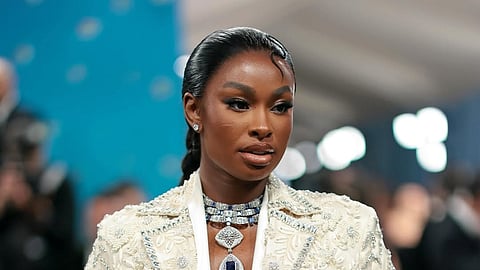 For the Met Gala 2025 red carpet, Coco Jones opted for a cream and white look created by Manish Malhotra featuring ornate embroidery throughout the dramatic long-sleeve coat with sharp lapels and coordinated trousers