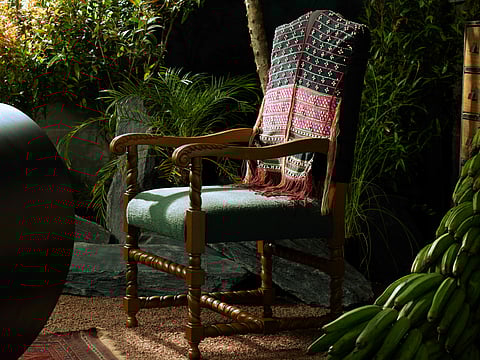 The furniture is made from reclaimed wood, tribal weaves