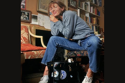 Jane Birkin poses with the OG Hermes Birkin bag