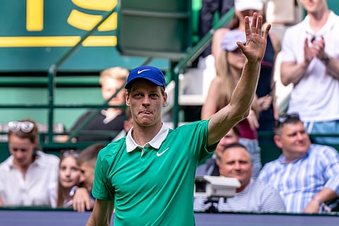 Italy's Jannik Sinner waves after winning his match against Germany's Yannik Hanfmann during the Halle ATP tennis tournament in Halle, Germany, Tuesday, June 17, 2025