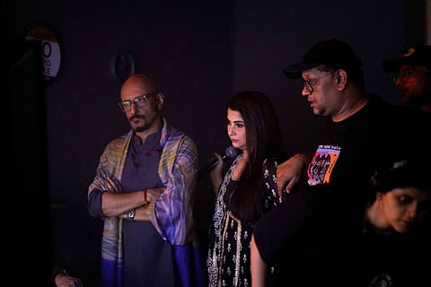 A BTS picture of Shantanu Moitra (L), Kaushiki Chakraborty and other crew members 