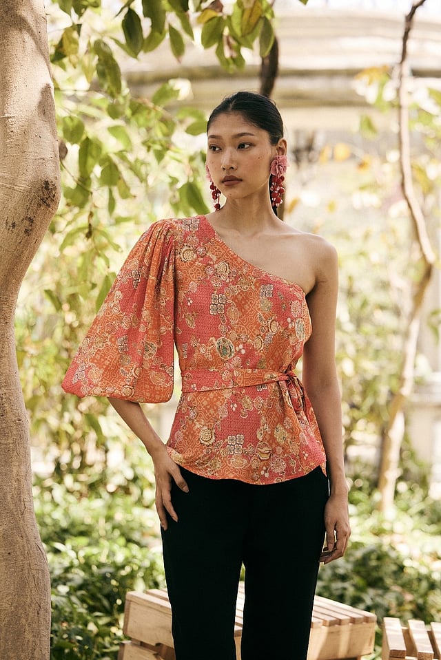 Lightweight Saundh Anar Juliet top with hand-painted pomegranate motifs in soft pastel shades, designed with airy fabric and a relaxed fit for comfortable, elegant summer wear.