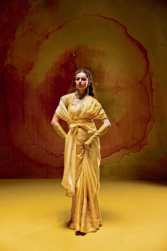 Elegant pastel ombré sari from Kavitha Gutta’s Noor-e-Gul collection, featuring delicate appliqué work and traditional Banarasi weave details.