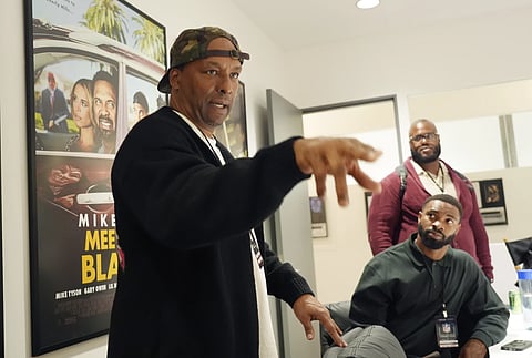 Deon Taylor (L) can be seen talking about Hollywood