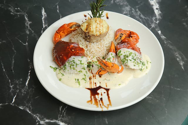 Butter garlic crab served with a cheesy jacket potato and steaming hot buttered rice at this newly-opened cafe in Salt Lake was a match made in heaven