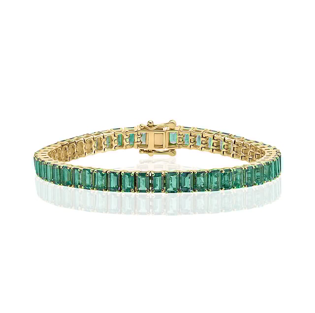 Eshli Fine Jewelry x Gemfields emerald-cut tennis bracelet featuring Zambian emeralds set in a sleek, fine jewelry design for timeless elegance.