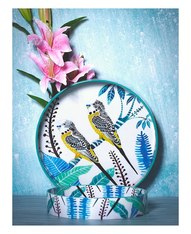 Handcrafted wooden gifting tray with floral motifs and pastel colors.