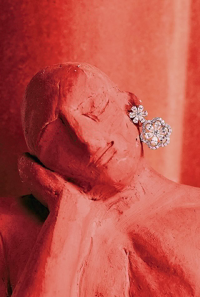 Close-up of floral stud earrings with VS-quality lab-grown diamonds 