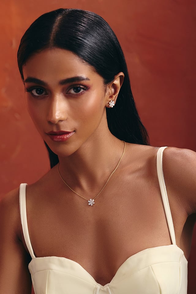 Woman wearing lab-grown diamond jewellery from the Blossom collection, styled for a casual brunch look