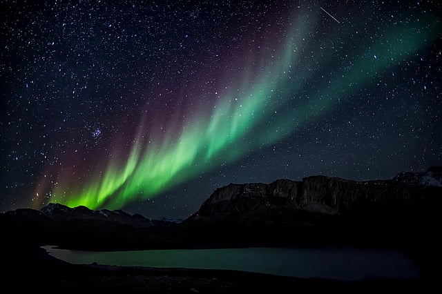 Neon greens, purples, and pinks twirling above you — that’s the Aurora Borealis.