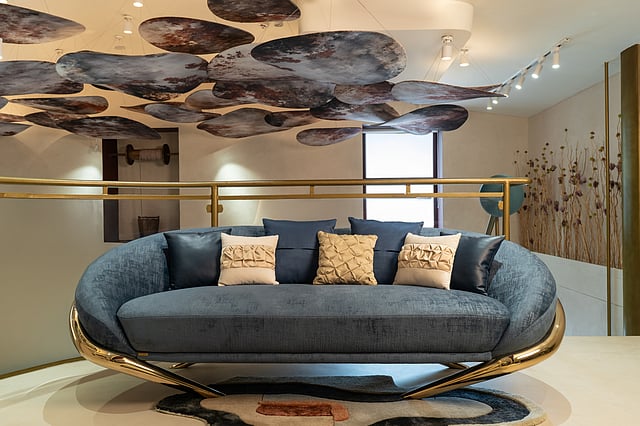 Art Deco-inspired furniture piece from the L’ILLUSTRE collection featuring bold geometry and sculptural, brutalist accents