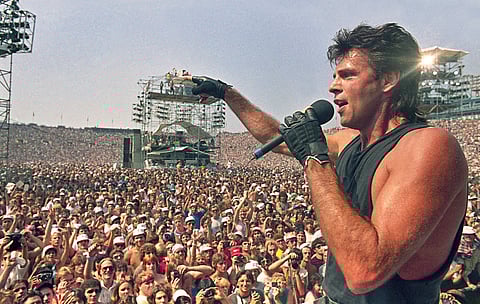 Rick Springfield performs at Live Aid, a famine relief concert at JFK Stadium in Philadelphia