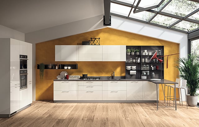 Turmeric yellow kitchen by Dash Square with haldi-toned walls, sleek cabinetry, and open shelving