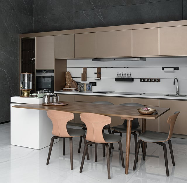 Nutmeg-toned kitchen by Essentia Environments featuring matte finishes, natural wood accents, and earthy hues