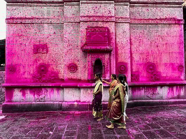 Devotees at Jyotiba Temple near Kolhapur, known as the Pink Temple for its vibrant gulal-covered walls