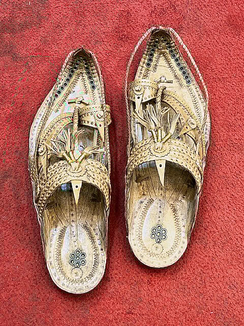 Close-up of ornate Shahu Maharaj Paytan with braided straps and traditional Kolhapuri detailing