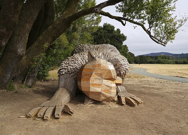 Giant trolls built from trash call for kinder living
