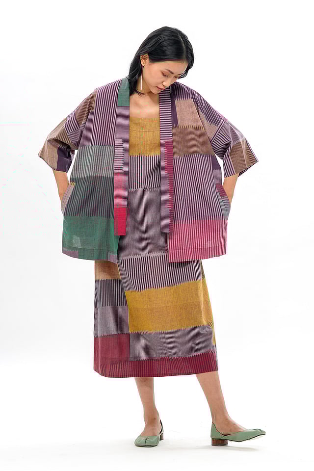 Model wearing Translate – Ikat India FUJI Slip Dress in handwoven ikat cotton, featuring a minimalist silhouette, soft drape, and a relaxed fit 