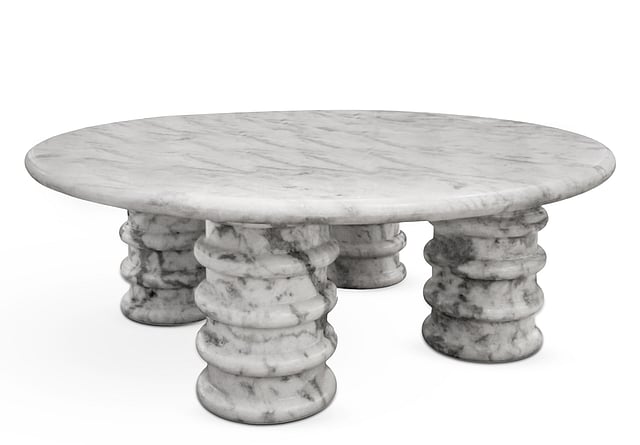 Handcrafted marble table by Avian that celebrate the natural beauty of stone