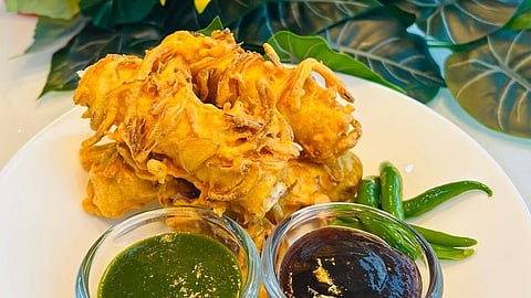 Take a cue from expert chefs and make the Onion Pakoda Coated Bread Cheese Rolls