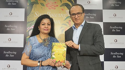 Author Lakshmi Murdeshwar Puri with film producer Vikram Malhotra with the book Swallowing the Sun