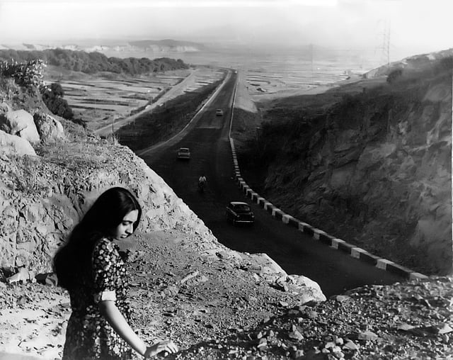 An image of daughter Aparajita standing above the Bombay-Poona Highway, Mid 1960s by Manobina Roy
