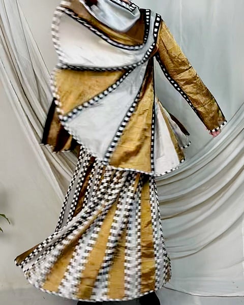 Sunhera introduces metallic touches of gold, silver, and bronze to Ka-Sha’s signature black and white applique designs