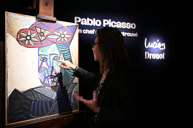 Art expert Agnes Sevestre-Barbe points to a rediscovered Picasso painting Bust of a Woman in a Flowery Hat