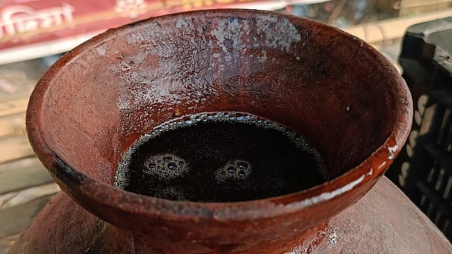 Khejur Gur is stored in earthen pots for sale 