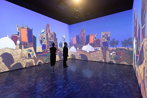 Visitors admiring the works of MF Husain