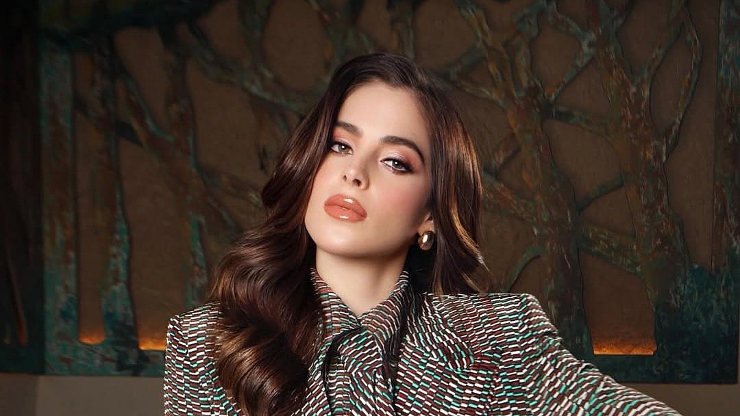 Miss Universe Fatima Bosch falls on a parade float at Ecuador festival