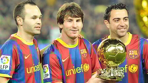 Three 2010 Ballon d'Or finalists: Andres Iniesta, Lionel Messi (winner) and Xavi Hernández