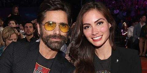 John Stamos and Caitlin McHugh
