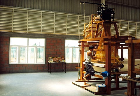 weaver_on_jacquard_loom