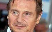 Liam Neeson practices yoga with Ralph Fiennes