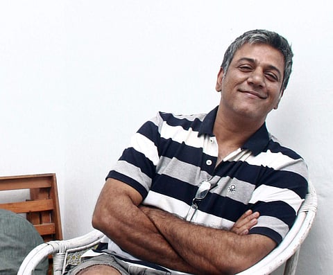 Mike Muthu steps off stage 