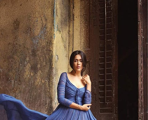 A collection of cerulean blue to steel blue gowns